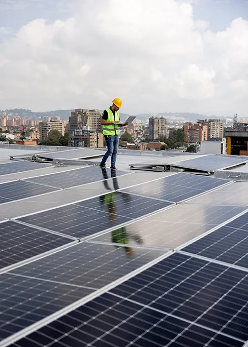 Engineer reading the levels of power supply of solar panels