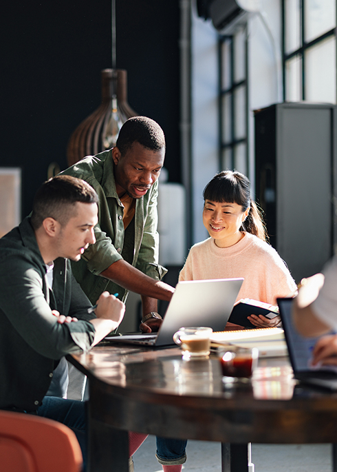 Diverse Team Working Together in Modern Co-Working Space